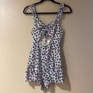 White with blue floral romper.